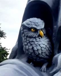 A statue of an owl

Description automatically generated